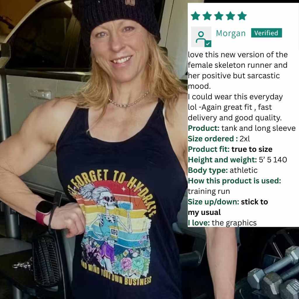 Person wearing a tank top with a graphic design, standing indoors.