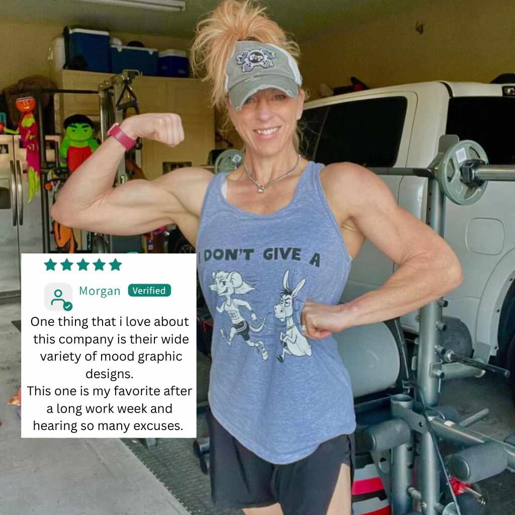Person flexing muscles in a gym wearing a tank top with a graphic design.