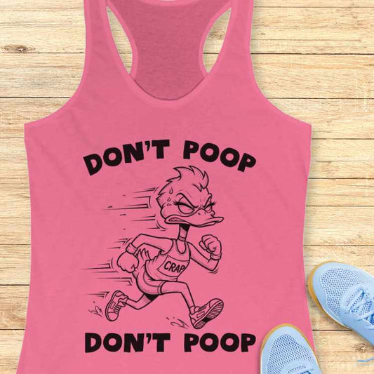 Graphic print on a pink tank top featuring a determined cartoon duck runner wearing a 'CRAP' singlet, framed by 'DON'T POOP' text, displayed on a wooden background with light blue athletic shoes