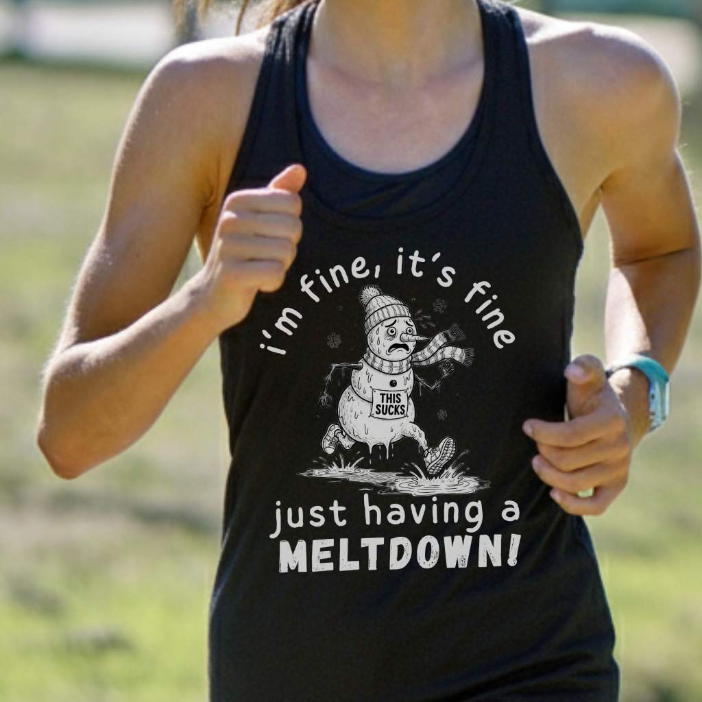 Person wearing a black tank top with a humorous snowman graphic and text outdoors.