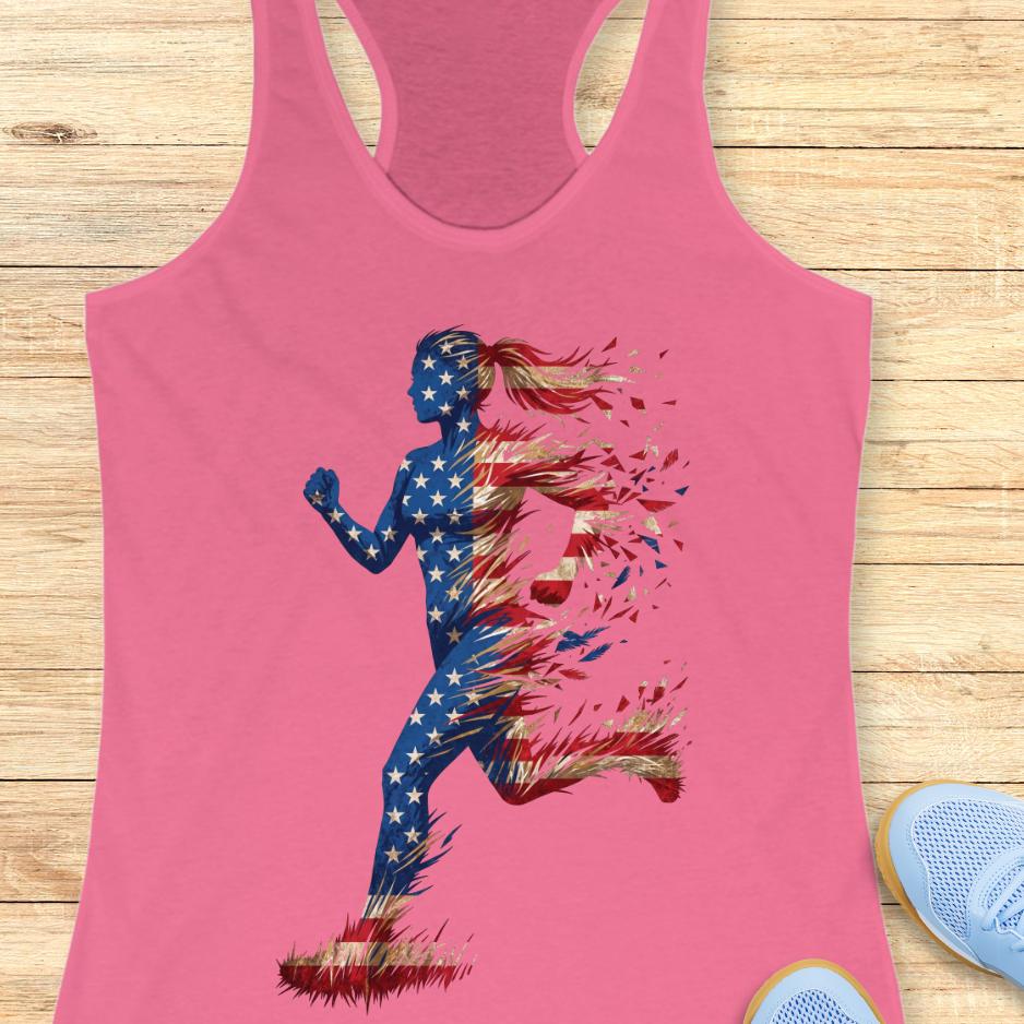 pink tank top with a colorful graphic of a running woman with American flag theme on a wooden surface