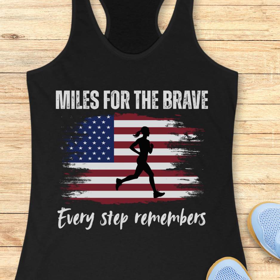 Black tank top with American flag and running silhouette on a wooden surface