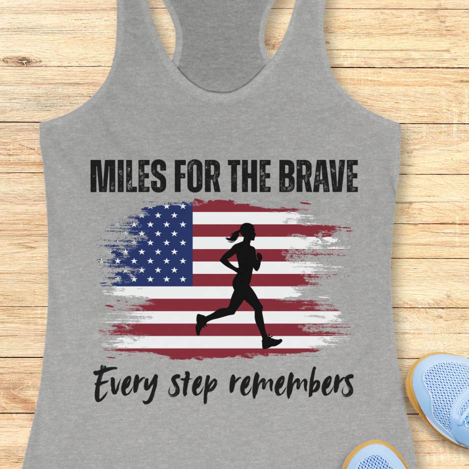 Gray tank top with American flag and running silhouette design on a wooden surface