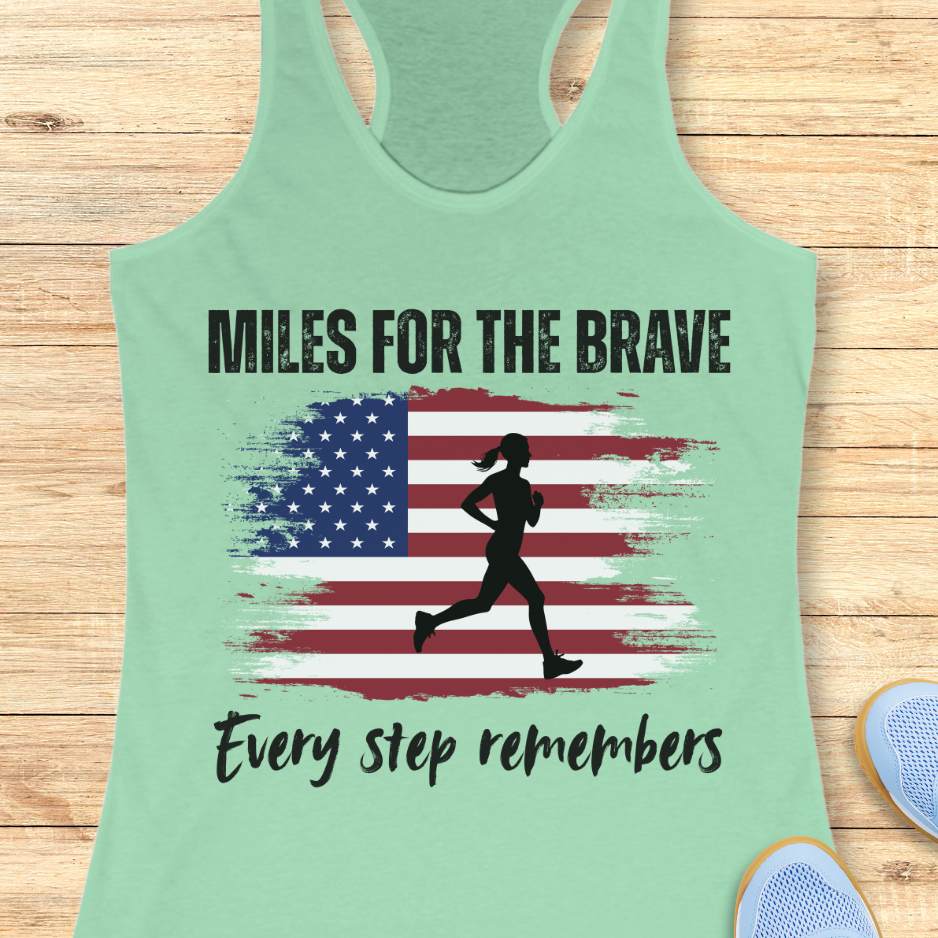 Mint green tank top with American flag and running silhouette design on a wooden surface