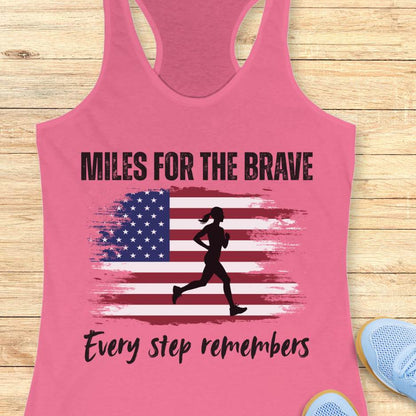 Pink tank top with American flag and running silhouette on a wooden surface