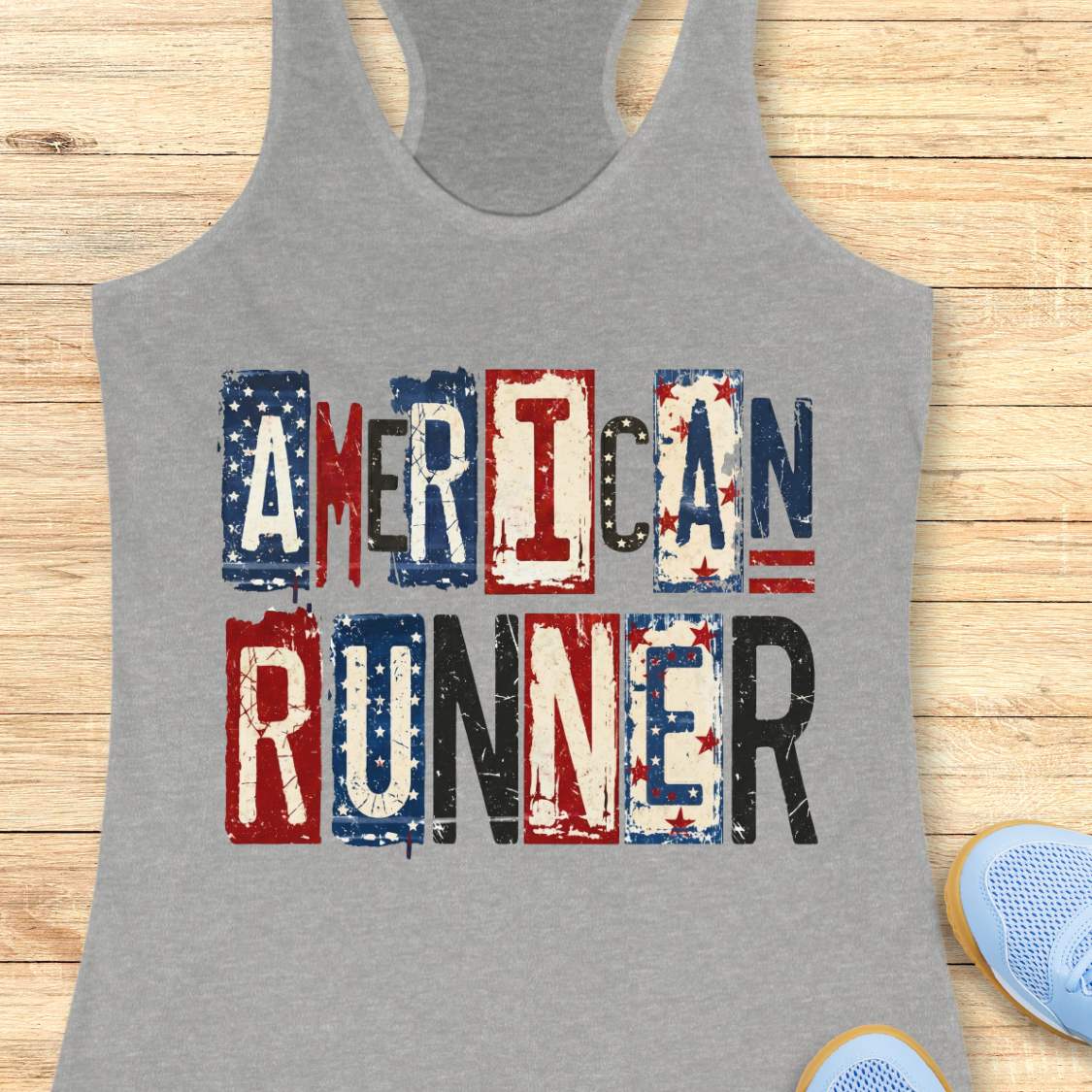Gray tank top with 'American Runner' text on a wooden surface