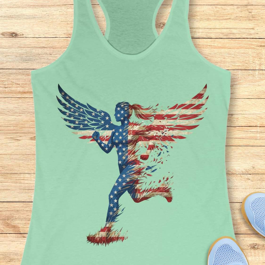 Mint green tank top with American flag design on a wooden surface