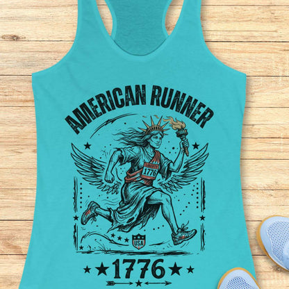 blue tank top with a design of lady liberty running and text - 'American runner 1776', on a wooden surface.