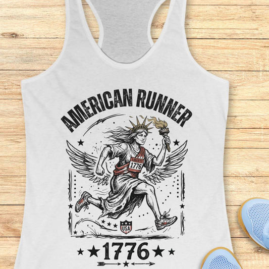white tank top with a design of lady liberty running and text - 'American runner 1776', on a wooden surface.