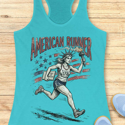 blue tank top with a design of lady liberty running and text - 'American runner', on a wooden surface.