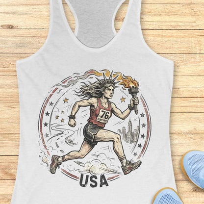 white tank top with a graphic design of a lady liberty as a runner and 'USA' text on a wooden surface.