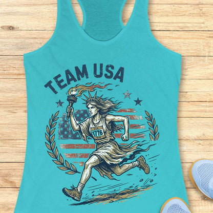 blue tank top with 'Team USA' design featuring lady liberty running and American flag on a wooden surface.