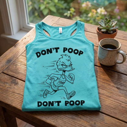 Teal blue graphic tank top featuring an angry cartoon duck wearing a "CRAP" bib and running, with "DON'T POOP" text repeated, on a light wood table with plants