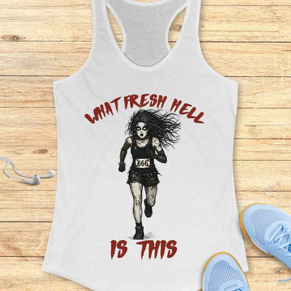 White racerback tank top depicting a distressed zombie-like woman running with a 666 bib and wild hair, surrounded by red 'What Fresh Hell Is This' text, displayed on a wood floor next to white earbuds and blue sneakers