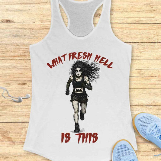 White racerback tank top depicting a distressed zombie-like woman running with a 666 bib and wild hair, surrounded by red 'What Fresh Hell Is This' text, displayed on a wood floor next to white earbuds and blue sneakers