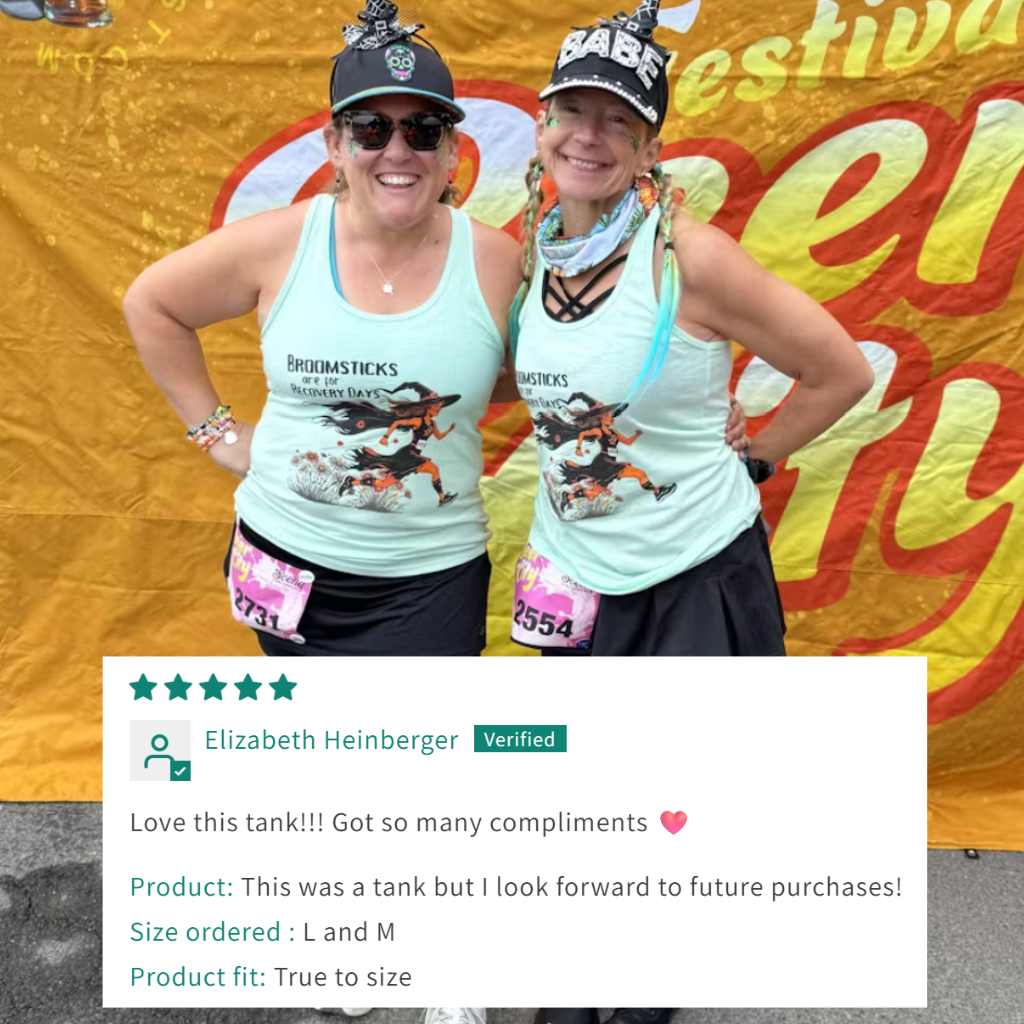 Two women wearing matching tank tops with a colorful banner in the background