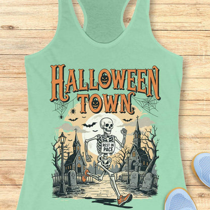 mint tank top with Halloween-themed design and a text ' Halloween town', on a wooden surface