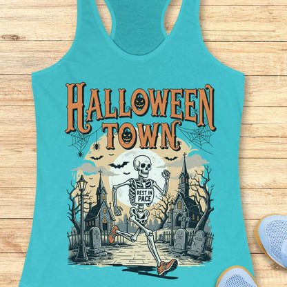 blue tank top with Halloween-themed design and a text ' Halloween town', on a wooden surface