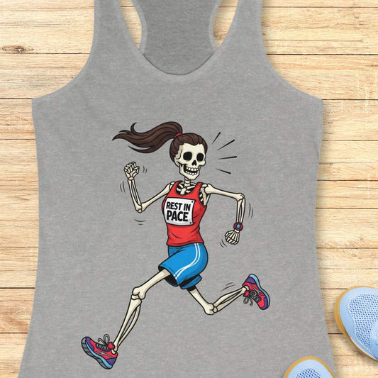 Graphic design on a grey tank top featuring a female skeleton with a ponytail running in a red 'REST IN PACE' top, blue shorts, colorful athletic shoes, and a fitness watch, laid flat on a light wood surface with white earbuds and light blue sneakers
