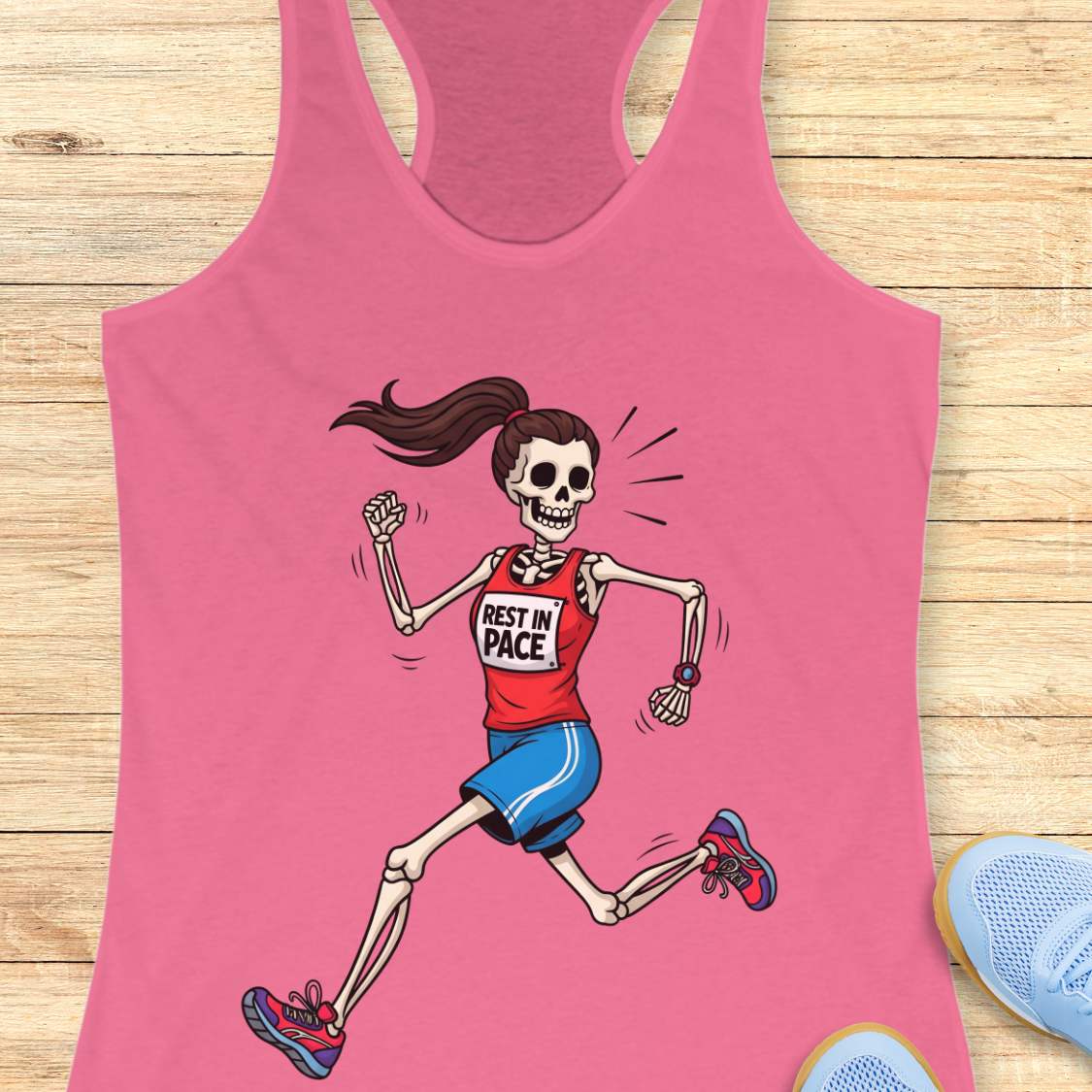 Graphic design on a pink tank top featuring a female skeleton with a ponytail running in a red 'REST IN PACE' top, blue shorts, colorful athletic shoes, and a fitness watch, laid flat on a light wood surface with white earbuds and light blue sneakers