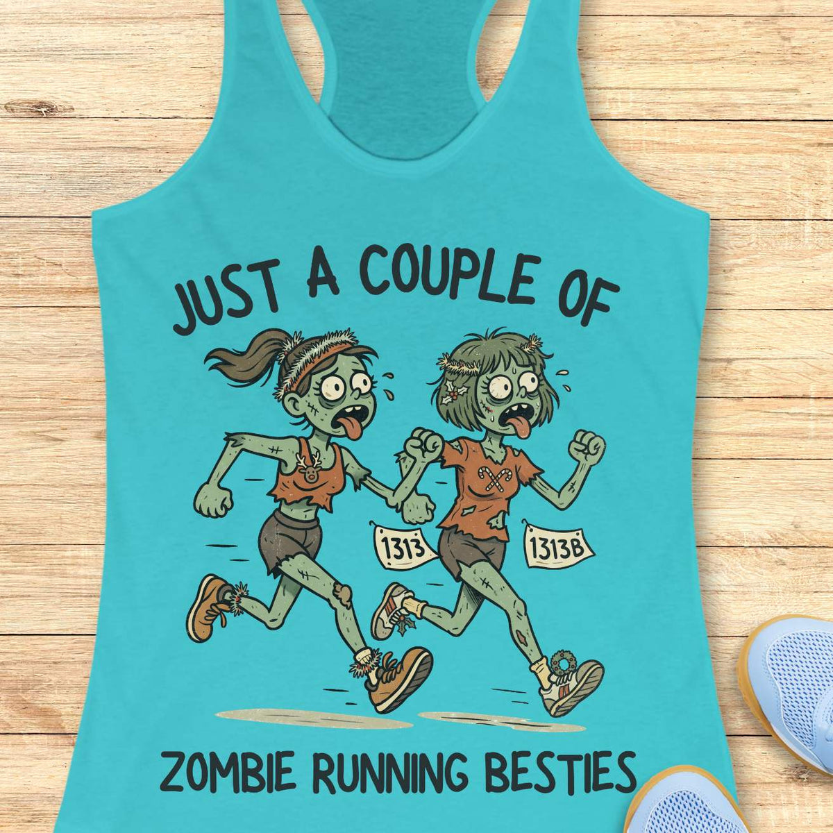 blue racerback tank top featuring the phrase “JUST A COUPLE OF” above two cartoon zombie runners and “ZOMBIE RUNNING BESTIES” below. The two zombie friends are running side by side wearing race bibs numbered 1313 and 1313B, with tattered running clothes, messy hair, and humorous zombie details. The playful Halloween-themed design combines friendship and running with a spooky, fun aesthetic perfect for runners who love Halloween.