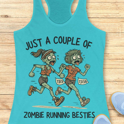 blue racerback tank top featuring the phrase “JUST A COUPLE OF” above two cartoon zombie runners and “ZOMBIE RUNNING BESTIES” below. The two zombie friends are running side by side wearing race bibs numbered 1313 and 1313B, with tattered running clothes, messy hair, and humorous zombie details. The playful Halloween-themed design combines friendship and running with a spooky, fun aesthetic perfect for runners who love Halloween.