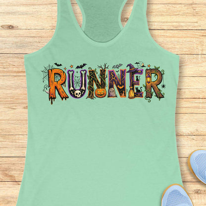 mint racerback tank top featuring the word “RUNNER” in large Halloween-themed decorative letters. Each letter is uniquely styled with spooky elements including spider webs, bats, a skull, twisting vines, a jack-o'-lantern, a gravestone marked “R.I.P.,” a witch’s hat, a broomstick, black cats, a lantern, a ghost, and a full moon. The colorful orange, purple, black, and green artwork creates a fun and festive Halloween design for runners who love spooky season.