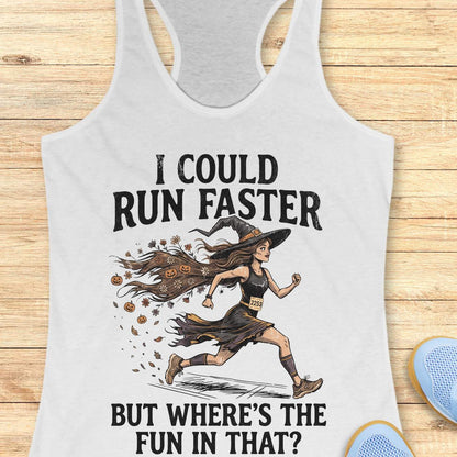whit racerback tank top featuring the humorous Halloween running quote, “I COULD RUN FASTER BUT WHERE’S THE FUN IN THAT?” The design shows a witch runner wearing a pointed hat, flowing tattered dress, and race bib number 2253, sprinting forward. Her long hair trails behind her, filled with autumn leaves, flowers, and small jack-o'-lanterns, creating a magical motion effect. The artwork combines running motivation with spooky Halloween charm, making it perfect for runners who prefer enjoying the journey over