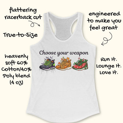 white women's racerback tank top displayed on a light wood background. The design features the phrase “Choose your weapon” in black script lettering above three themed running shoes. The first shoe has a Halloween design with spiderwebs, pumpkins, bats, and skulls. The second shoe has an autumn theme with pumpkins, leaves, and acorns. The third shoe has a Christmas theme with candy canes, holly, snowflakes, and gift boxes. Partial running shoes are visible in the lower corners of the image.