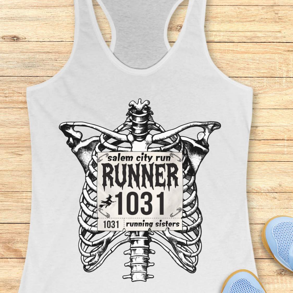 Funny Halloween running white tank top featuring a detailed black-and-white skeleton ribcage with a vintage race bib pinned across the chest. The bib reads “Salem City Run,” “RUNNER 1031,” and “1031 Running Sisters,” with spooky gothic typography and a small witch silhouette on a broomstick. The design is printed on a black racerback tank top and combines witchy Salem vibes, Halloween aesthetics, and women's running culture.