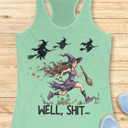 Funny women’s running mint tank top featuring a witch runner in purple athletic gear riding a broomstick during a Halloween run, chased by flying witches overhead. The design includes the humorous slogan “WELL, SHIT...” and is perfect for women runners, Halloween races, marathon training, trail running, and runner humor gifts.