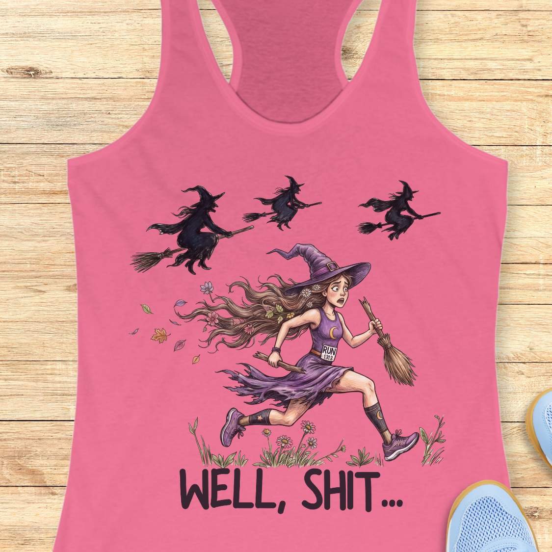 Funny women’s running pink tank top featuring a witch runner in purple athletic gear riding a broomstick during a Halloween run, chased by flying witches overhead. The design includes the humorous slogan “WELL, SHIT...” and is perfect for women runners, Halloween races, marathon training, trail running, and runner humor gifts.