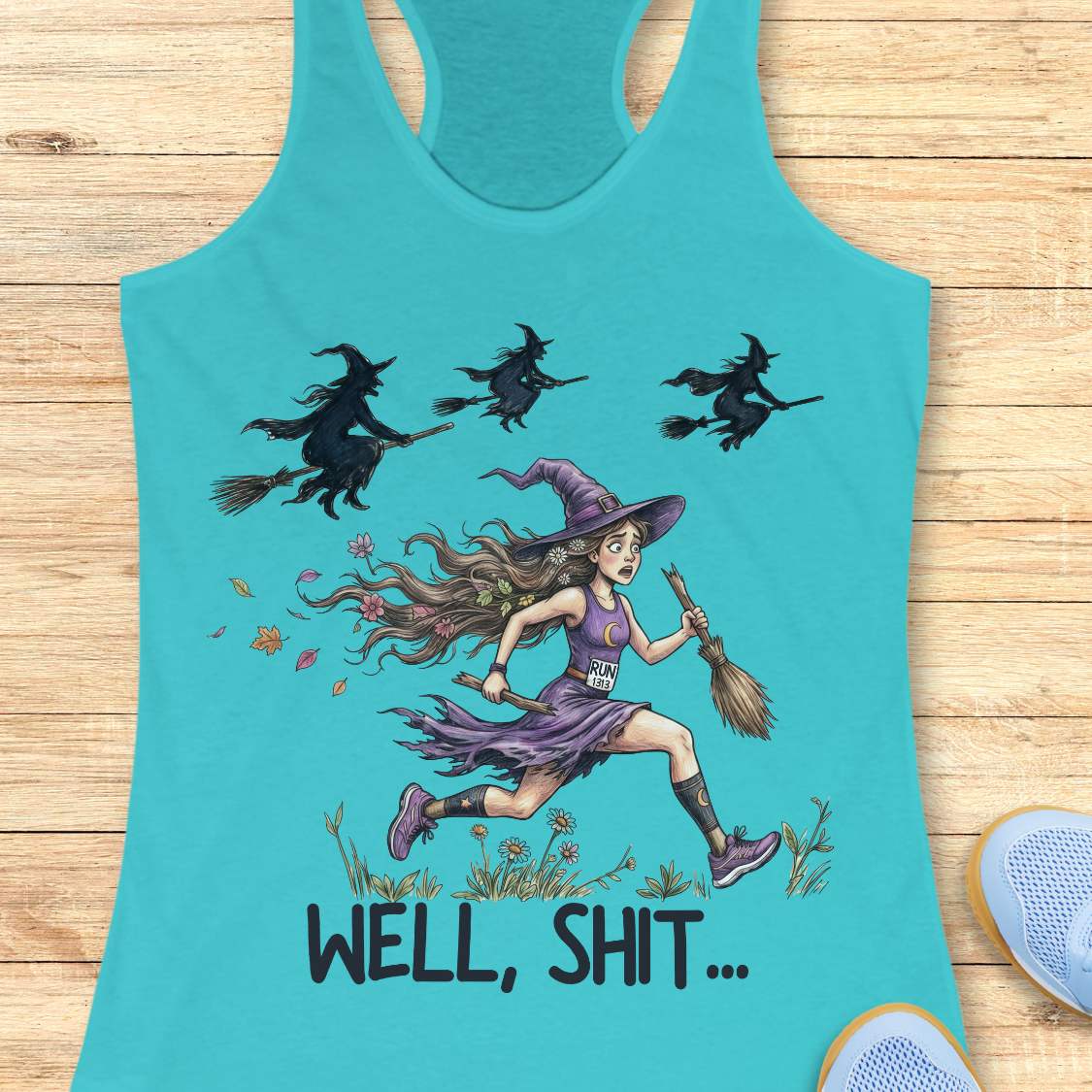 Funny women’s running blue tank top featuring a witch runner in purple athletic gear riding a broomstick during a Halloween run, chased by flying witches overhead. The design includes the humorous slogan “WELL, SHIT...” and is perfect for women runners, Halloween races, marathon training, trail running, and runner humor gifts.