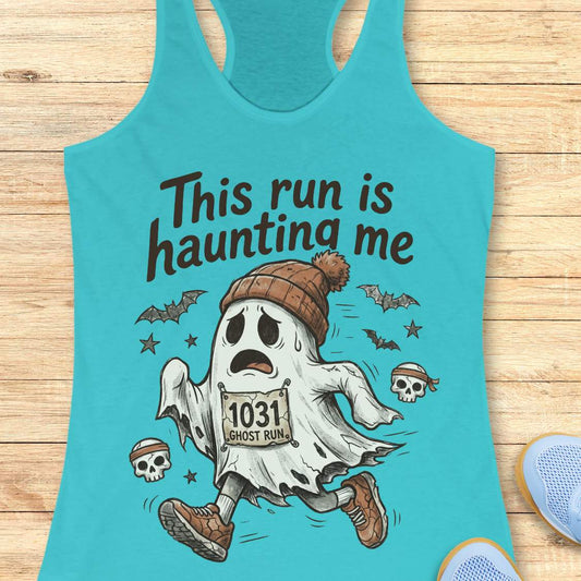 blue Halloween tank top with an image of a running ghost and text 'This run is haunting me', on a wooden surface