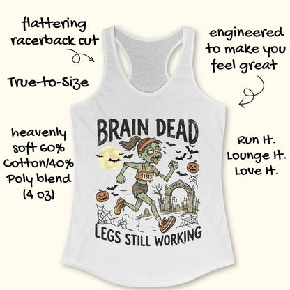 white Halloween tank top with an image of a running zombie and text 'Brain dead legs still working', on a wooden surface