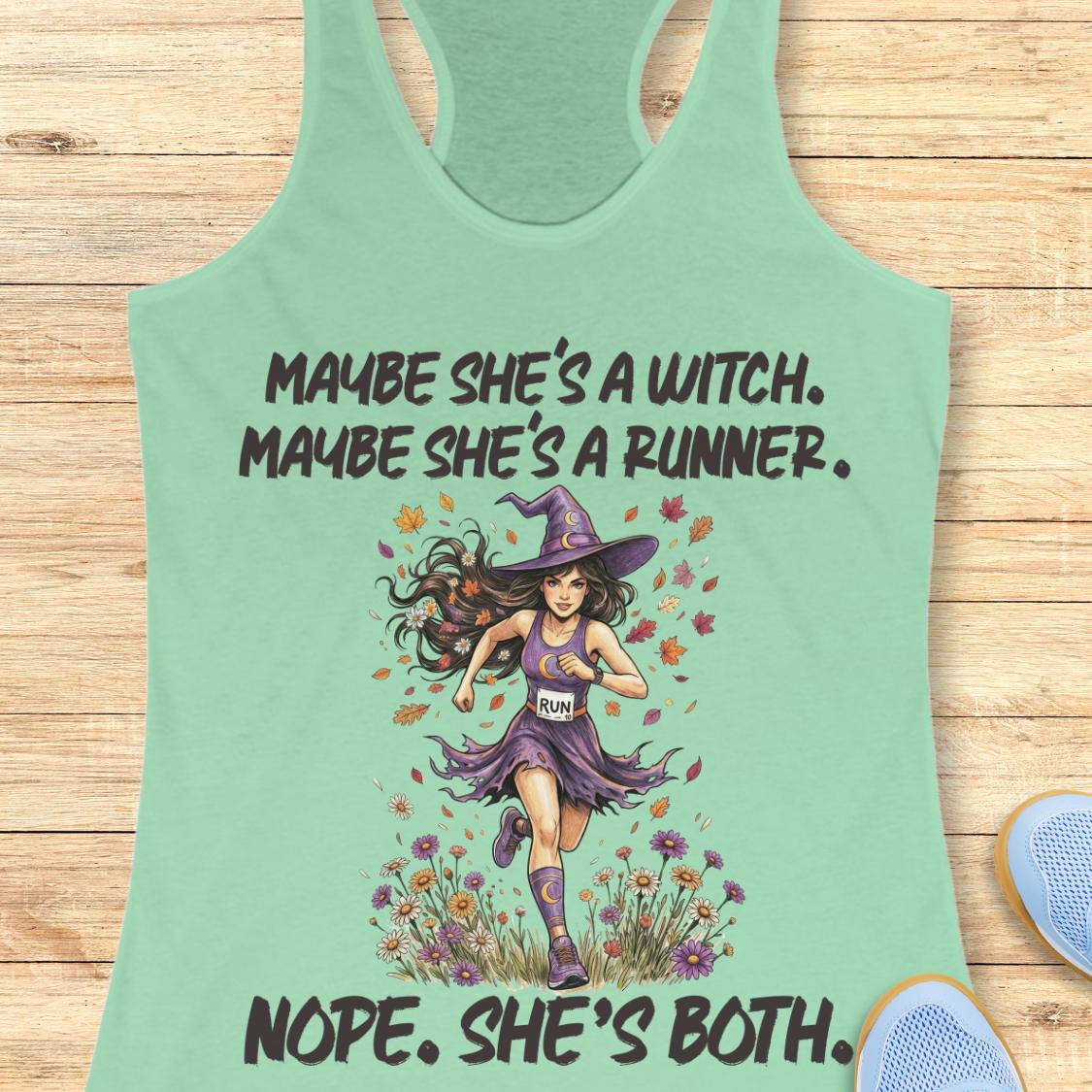 A mint green racerback tank top laid flat on a light wood background, featuring a graphic of a girl running as a witch with the text 'MAYBE SHE'S A WITCH. MAYBE SHE'S A RUNNER.