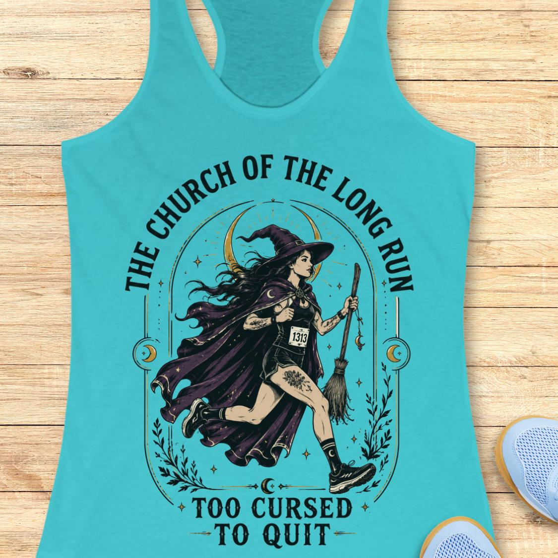 A turquoise racerback tank top laid flat on a light wood background, featuring a large graphic of a witch running with a broom and the text 'THE CHURCH OF THE LONG RUN TOO CURSED TO QUIT'. A blue shoe is partially visible at the bottom right.