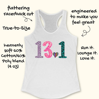 White racerback tank top with a colorful '13.1' graphic on the front, surrounded by promotional text callouts on a light cream background.