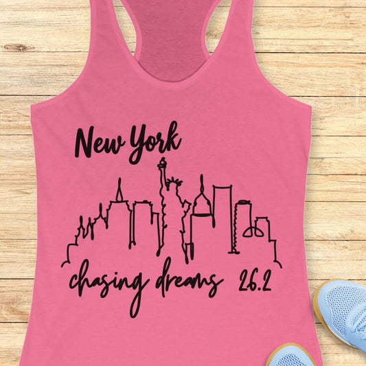 pink tank top with new york skyline and text - New York, chasing dreams 262., on a wooden background