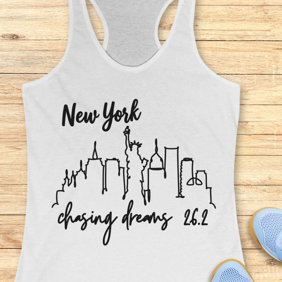 white tank top with new york skyline and text - New York, chasing dreams 262., on a wooden background