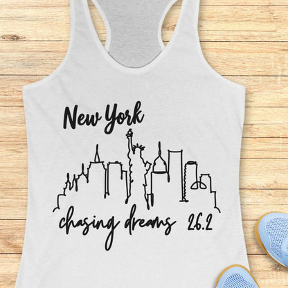 white tank top with new york skyline and text - New York, chasing dreams 262., on a wooden background