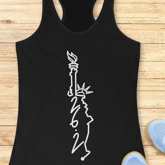 black tank top with an image of lady liberty and the number 26.2 with a wooden background