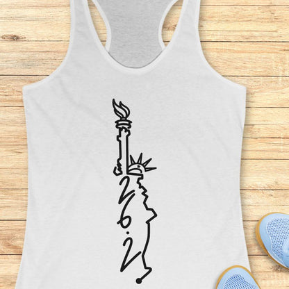 white tank top with an image of lady liberty and the number 26.2 with a wooden background