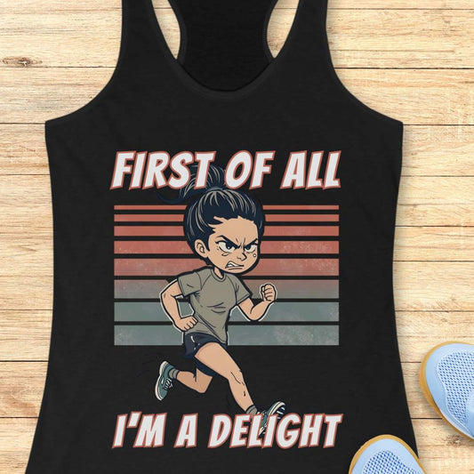 Black tank top with a graphic of a character running and text 'First of all I'm a delight' on a wooden surface.