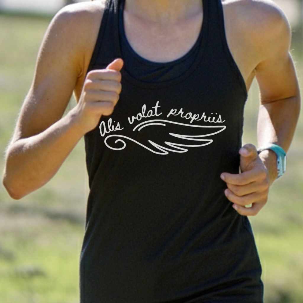 Photograph of a person running outdoors wearing a black tank top featuring white 'Alis volat propriis' script and a wing graphic, a teal smartwatch, and a ring on their right hand