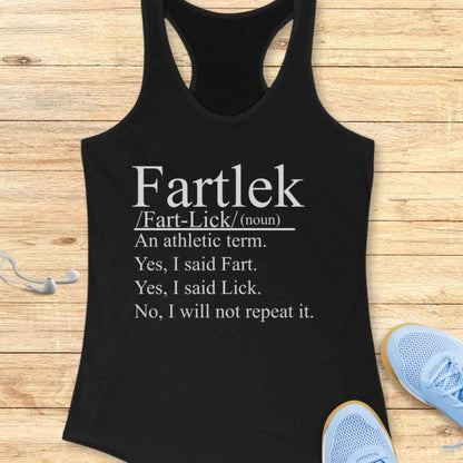Black athletic tank top featuring white text defining 'Fartlek' as an athletic term with the humorous breakdown 'Yes, I said Fart. Yes, I said Lick. No, I will not repeat it,' displayed on a wooden surface alongside light blue running shoes and white earbuds