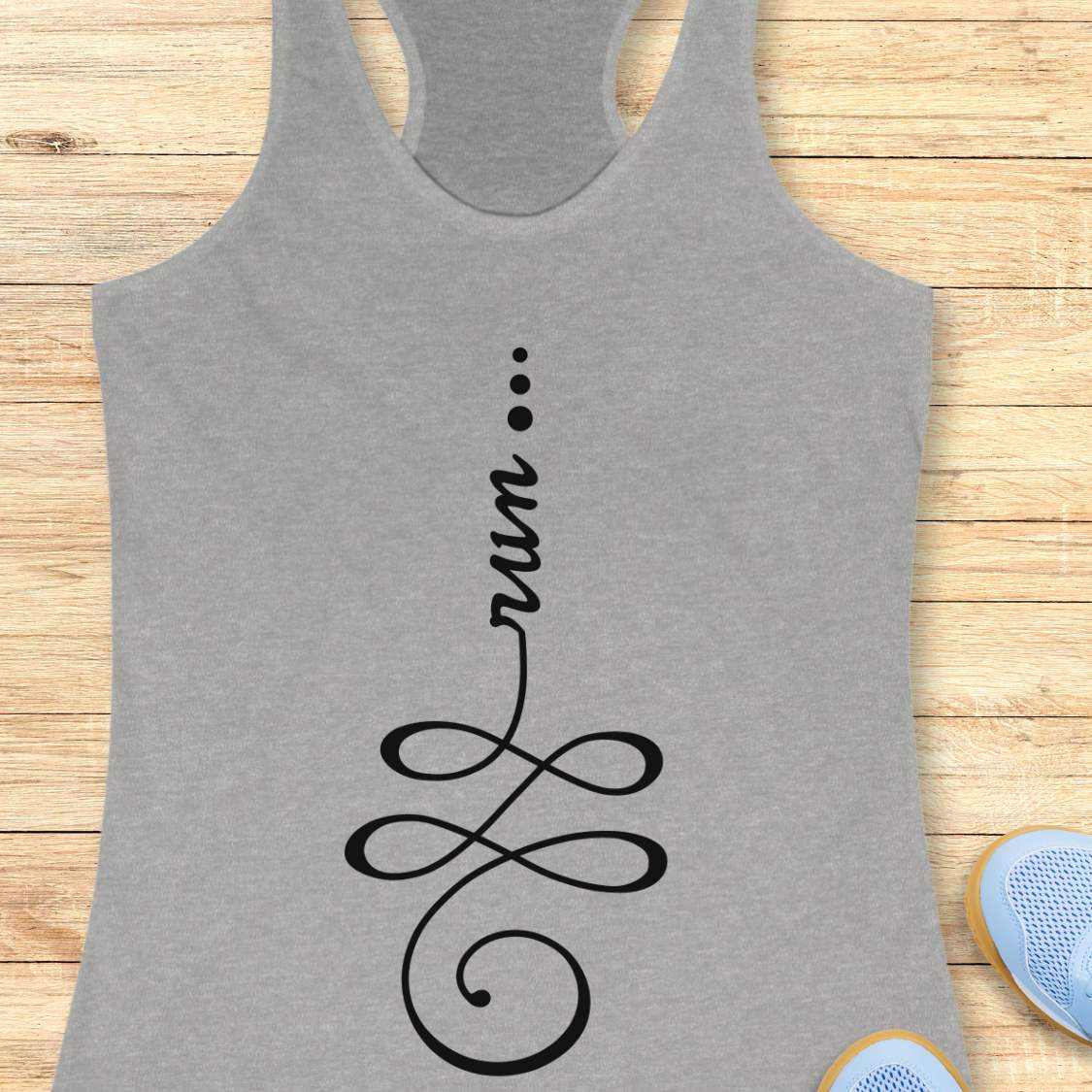 A heather gray racerback tank top with a black graphic print reading 'run.