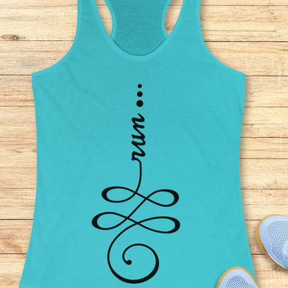 A turquoise racerback tank top with a black graphic print reading 'run' above an infinity symbol, laid flat on a light wood plank background with partial sneakers visible at the edges.