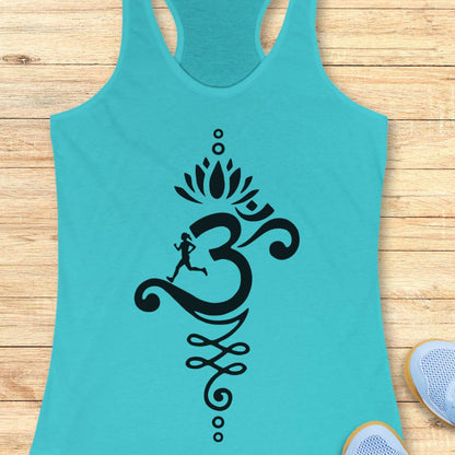 A turquoise racerback tank top with a large black Om symbol and running figure graphic on the front, displayed flat on a light wood plank background with partial sneakers visible at the edges.