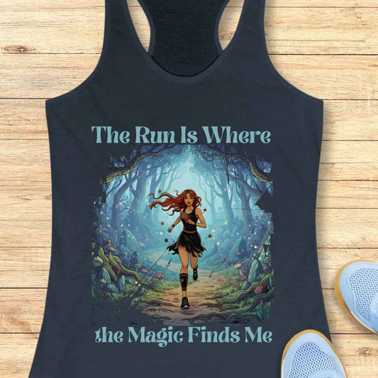 Graphic print on a dark blue tank top featuring a red-haired woman running through a glowing blue-green enchanted forest with floating red petals and light blue capped mushrooms, accompanied by the text The Run Is Where the Magic Finds Me